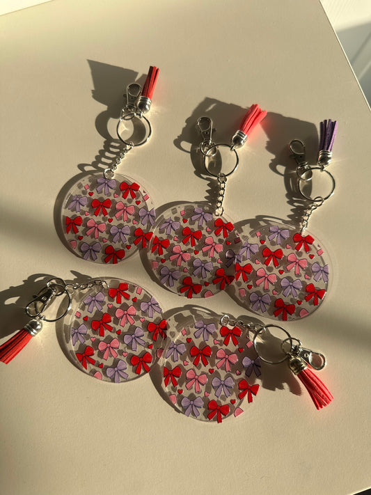 Red, pink, purple bows acrylic keychain