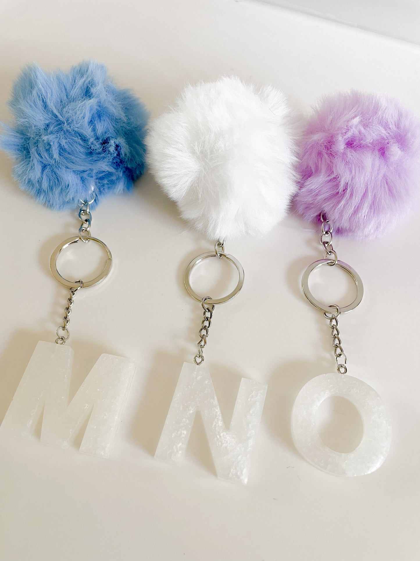 White initial silver keychain w/Pom