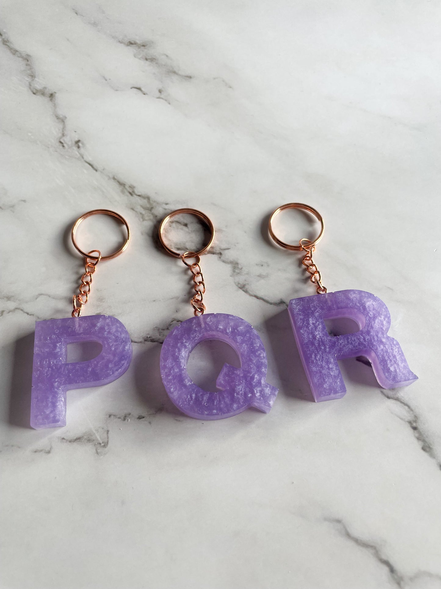 Purple initial rose gold keychain