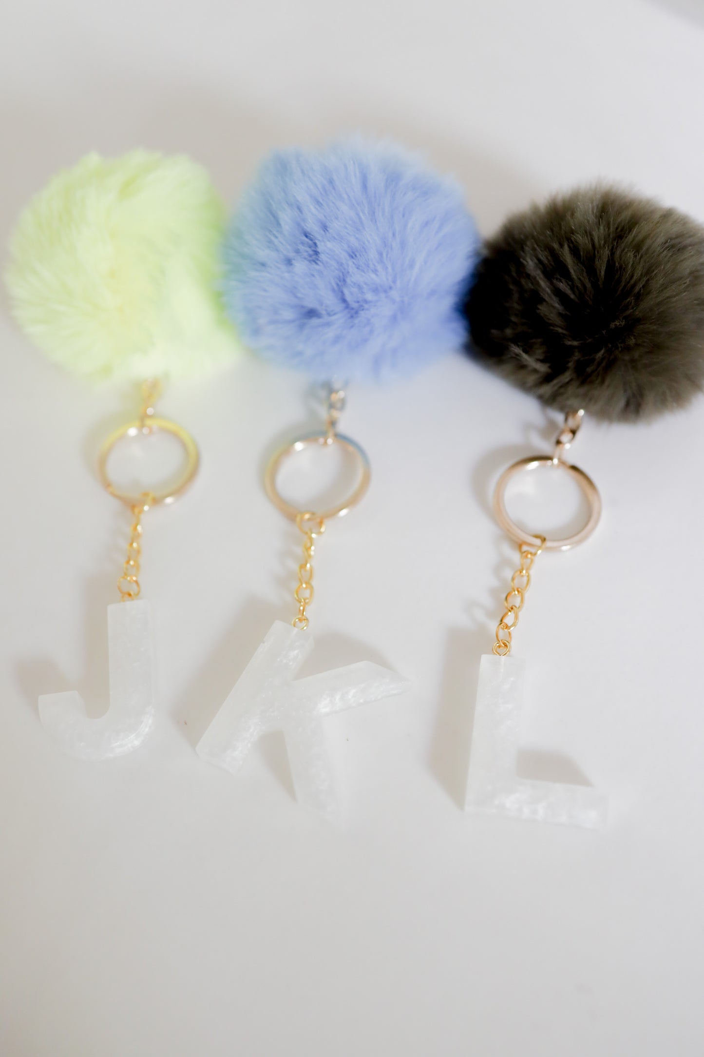 White initial Gold keychain w/pom