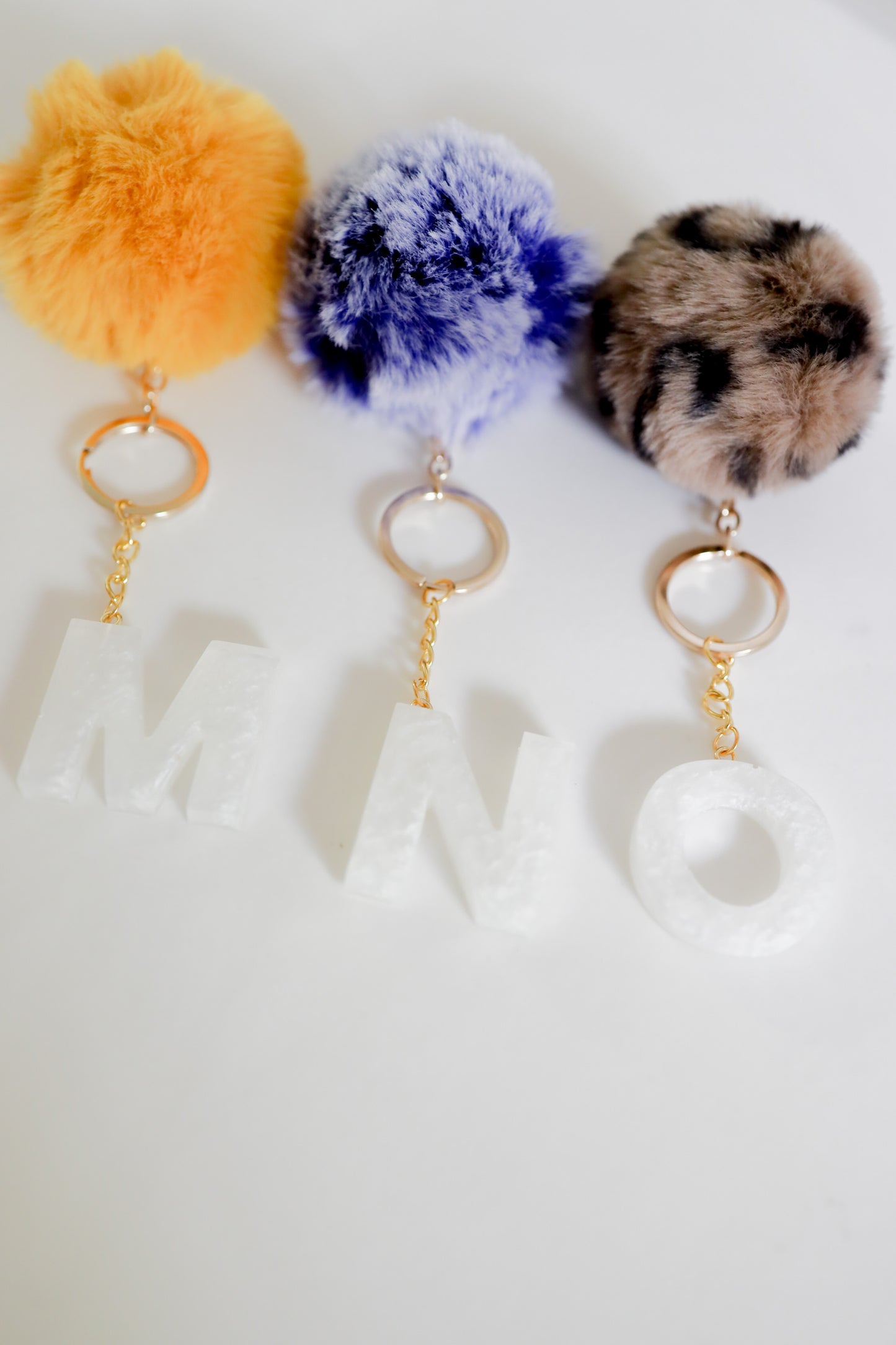 White initial Gold keychain w/pom