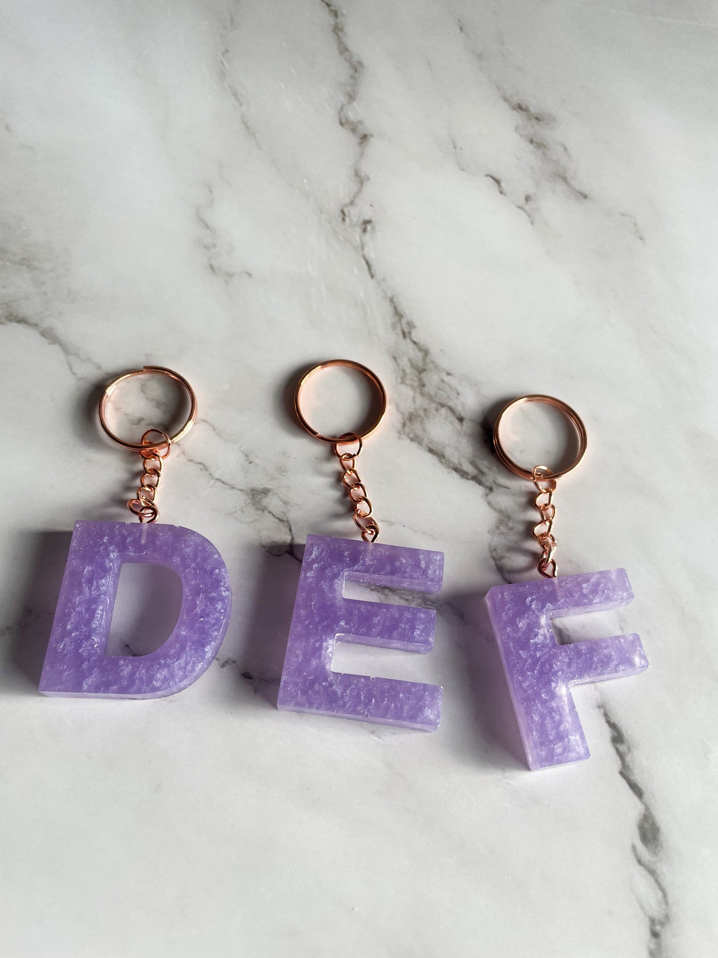 Purple initial rose gold keychain