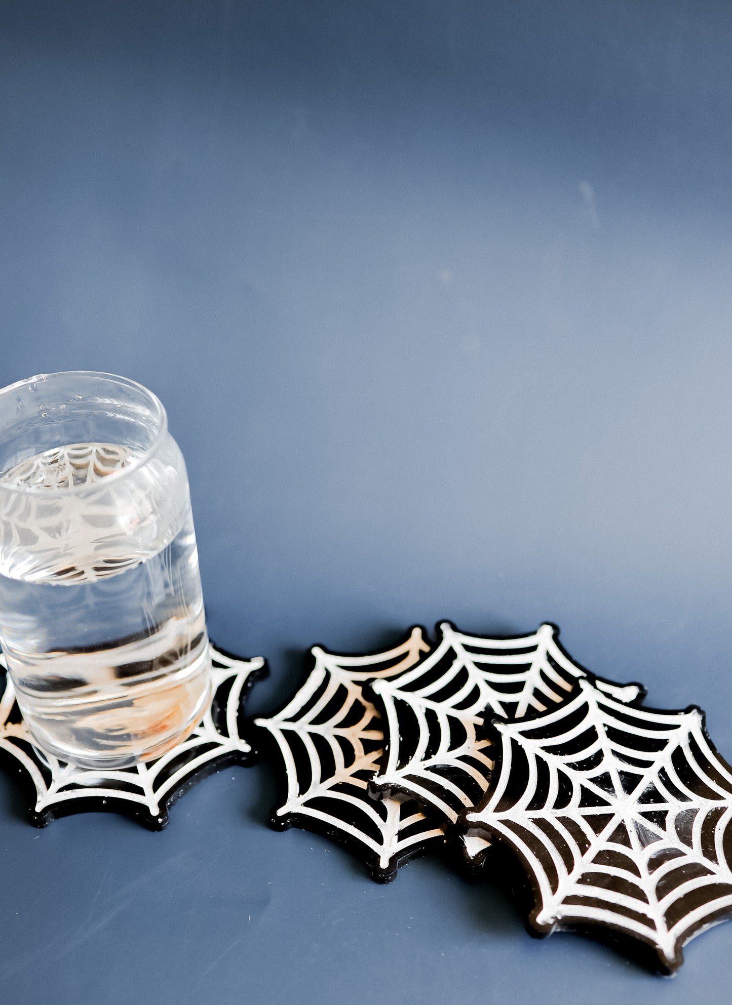 Spider web coasters