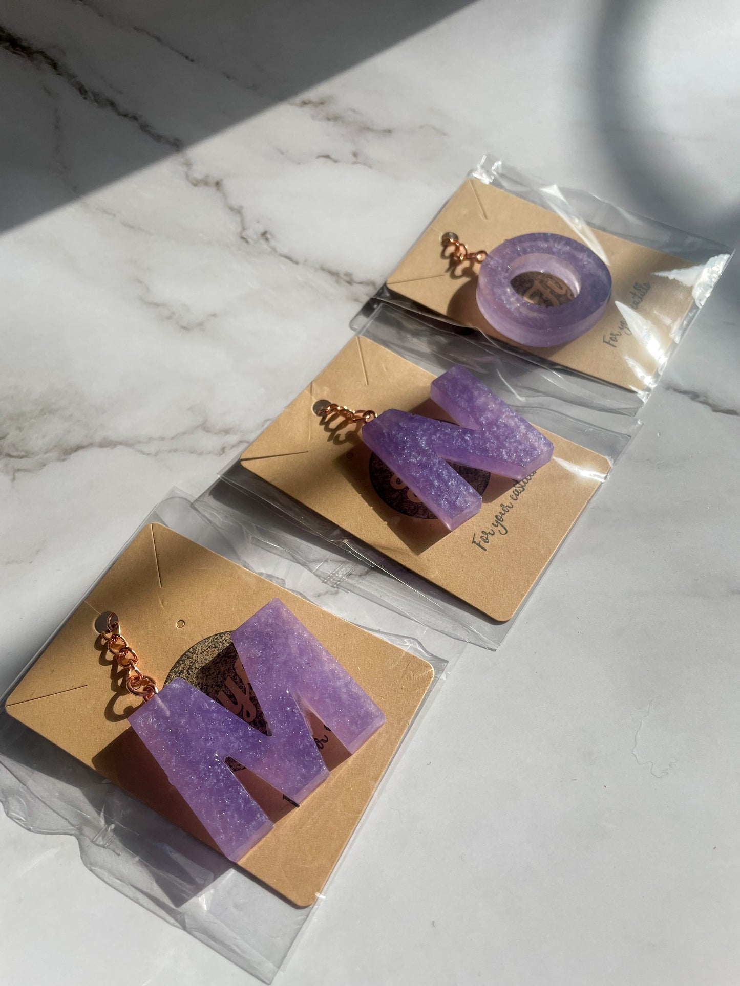 Purple initial rose gold keychain