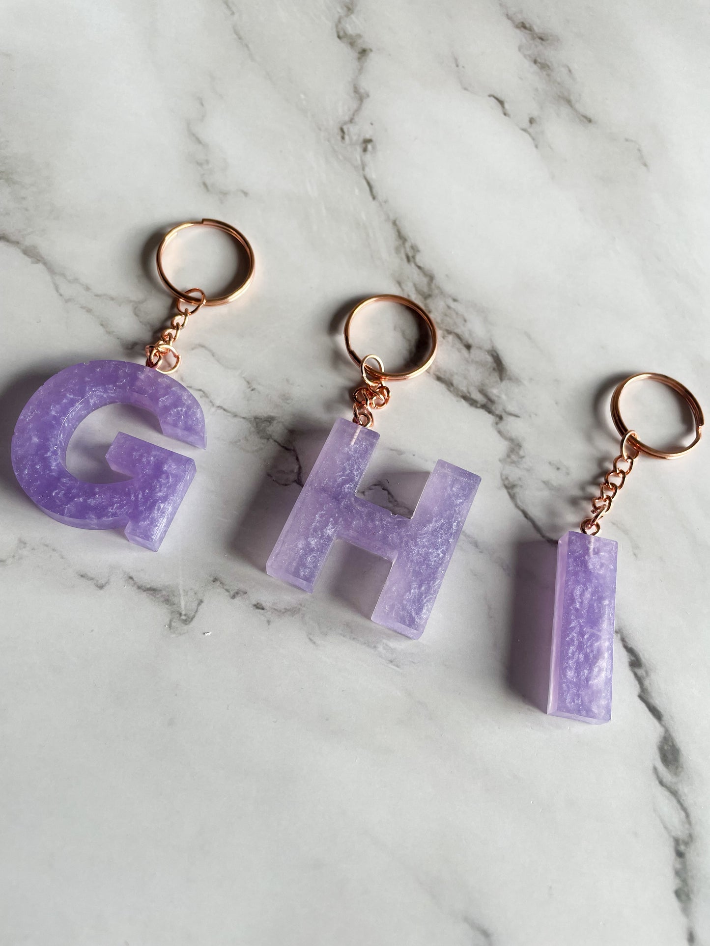 Purple initial rose gold keychain