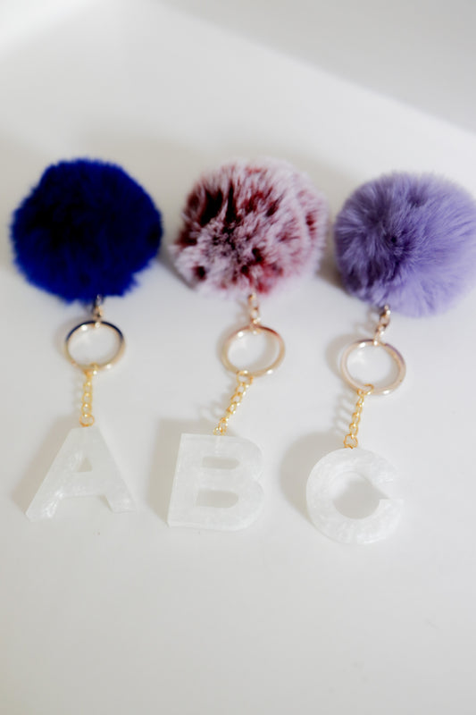 White initial Gold keychain w/pom