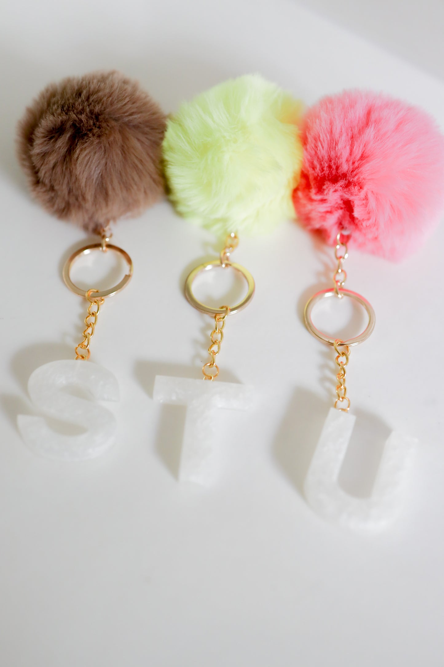 White initial Gold keychain w/pom
