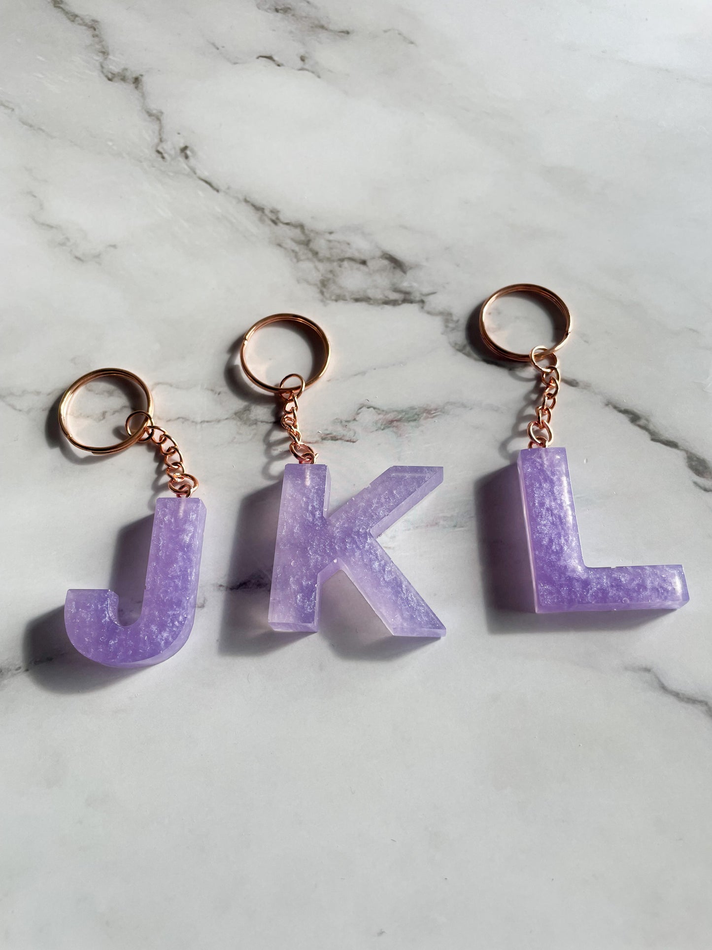 Purple initial rose gold keychain