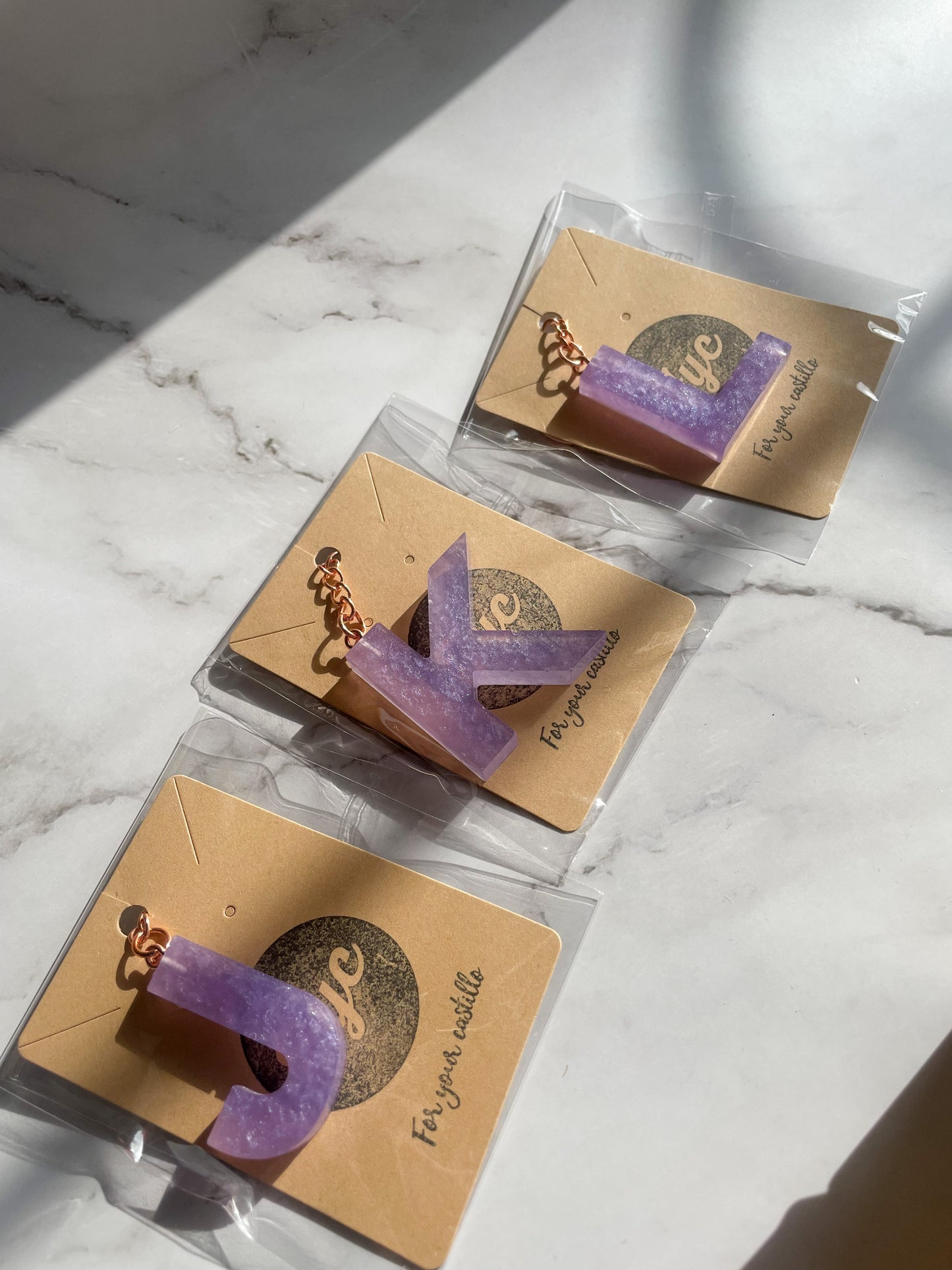 Purple initial rose gold keychain