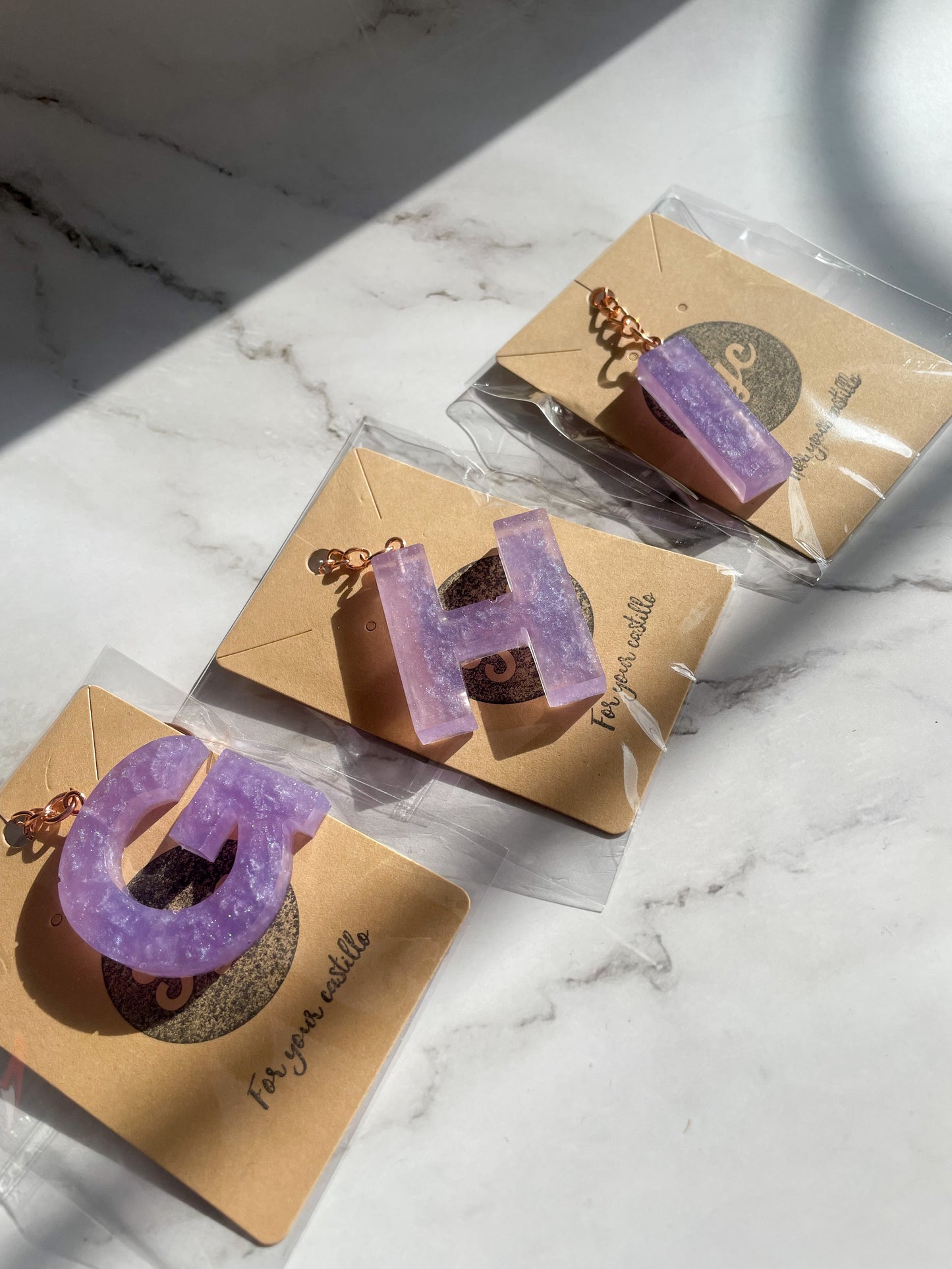 Purple initial rose gold keychain
