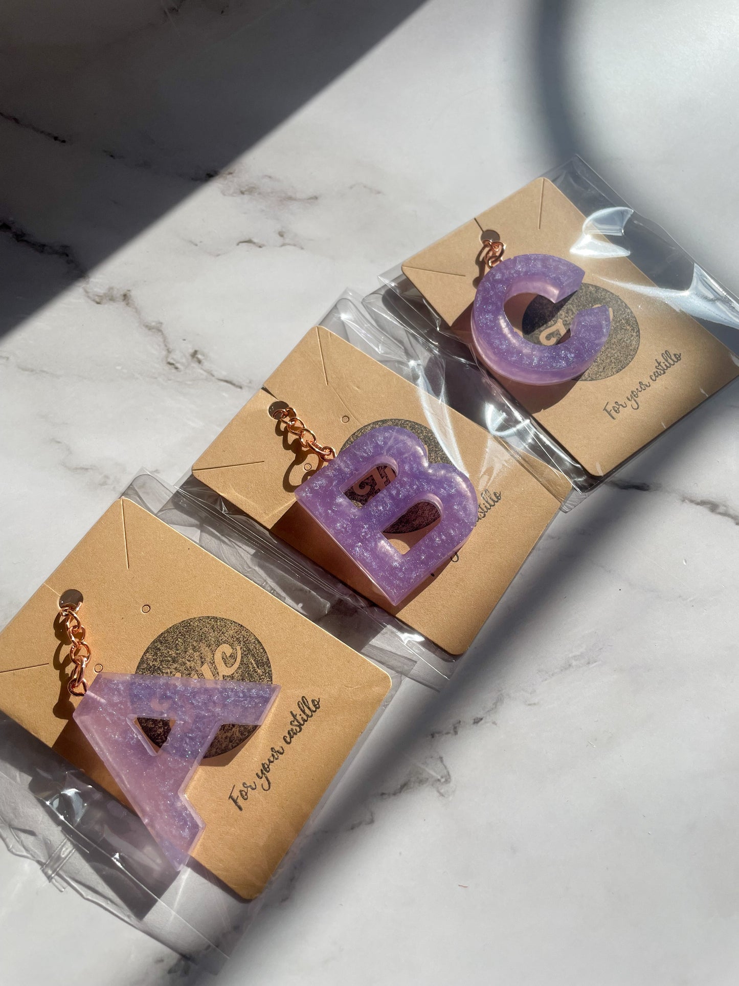Purple initial rose gold keychain