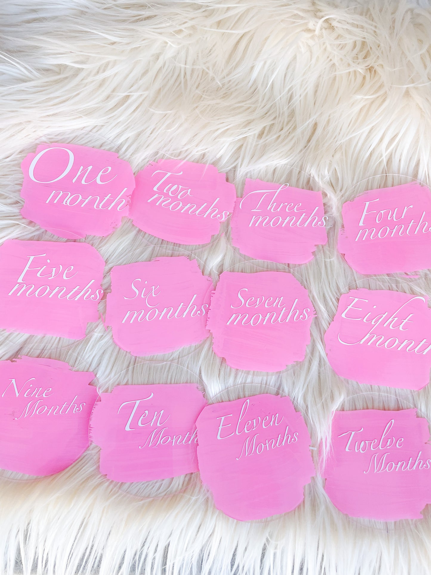 Pink baby monthly milestone