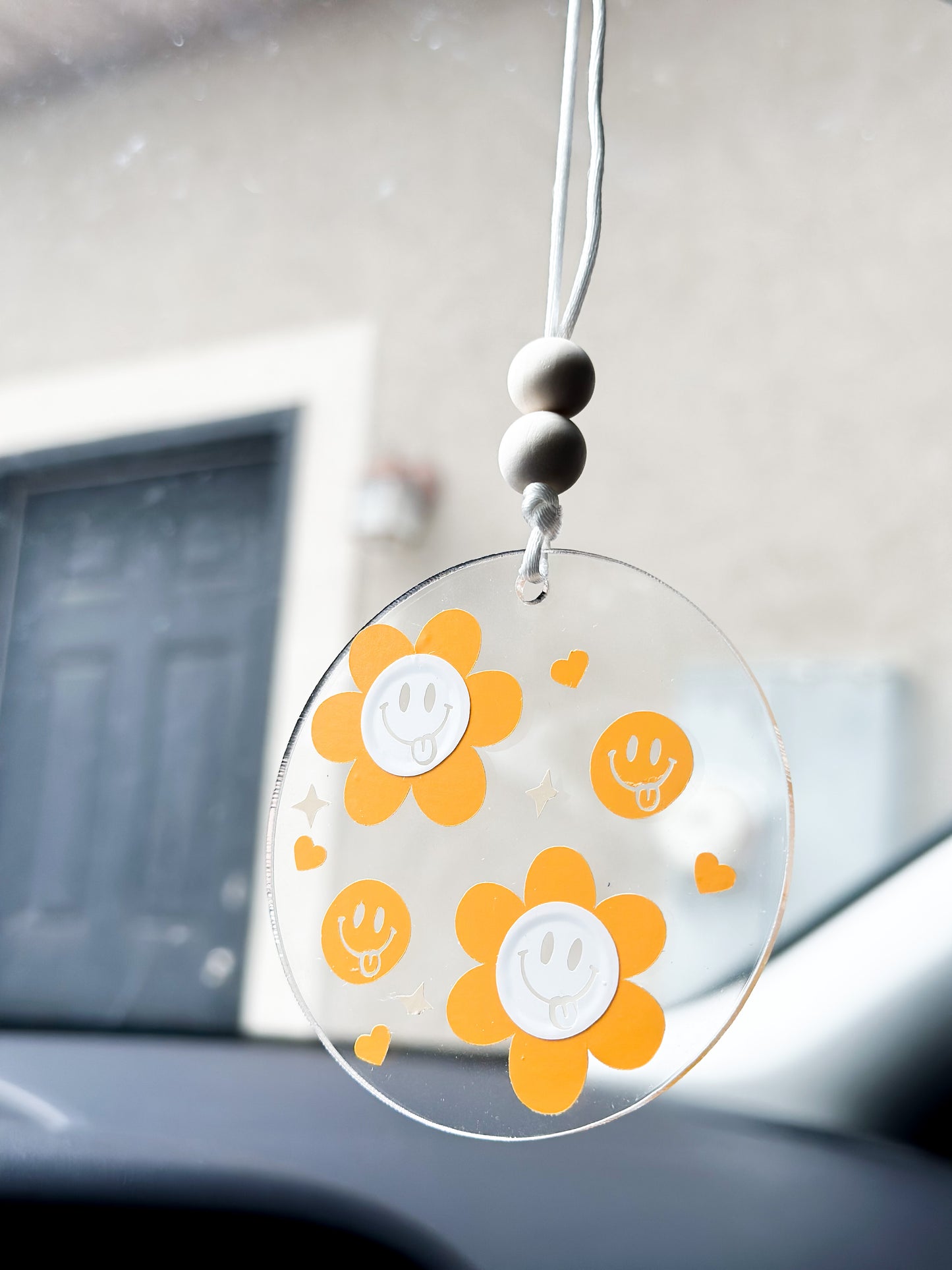 Orange smiley floral car hanger