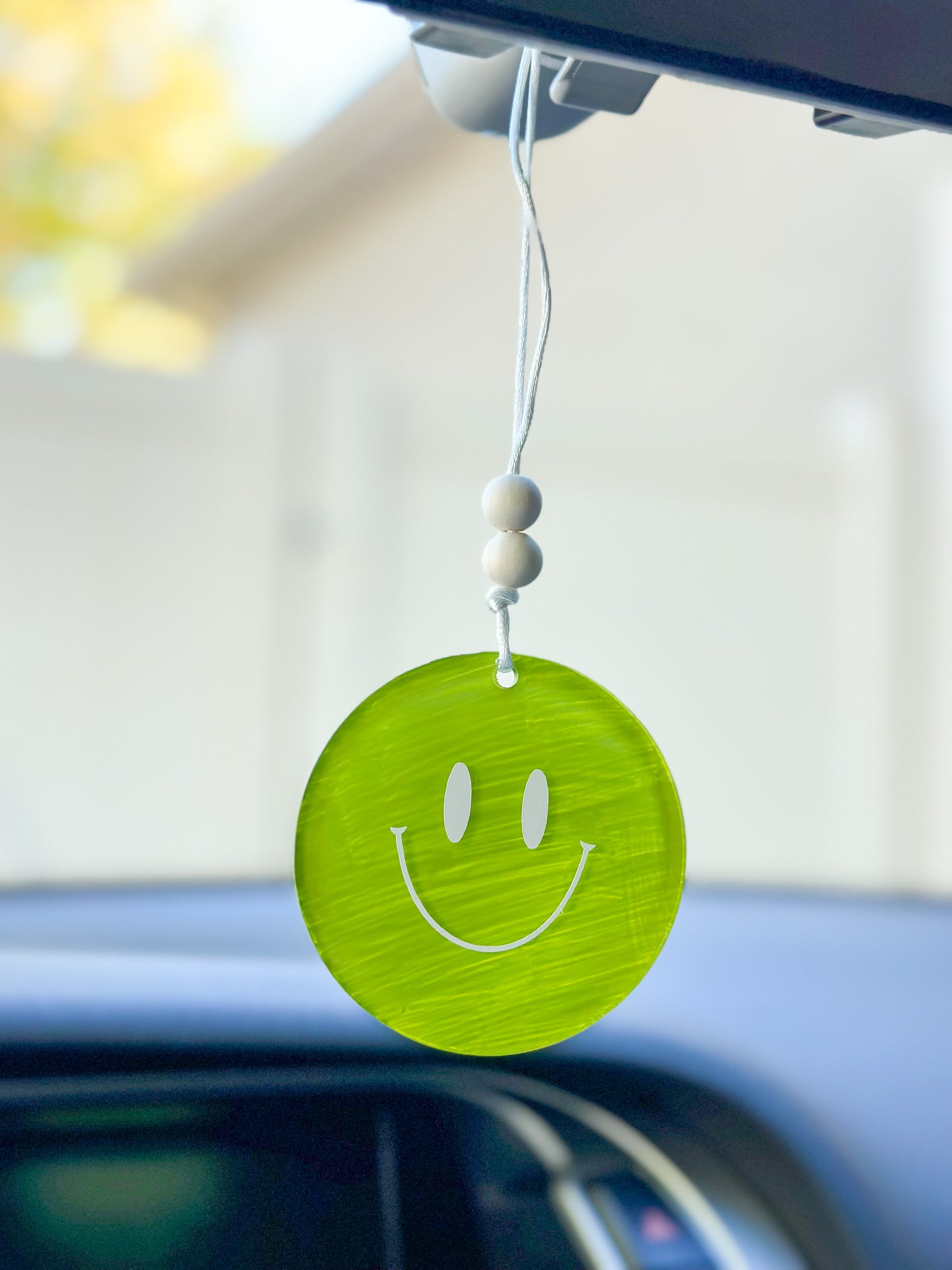 Green smiley face car hanger