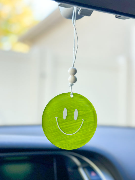 Green smiley face car hanger