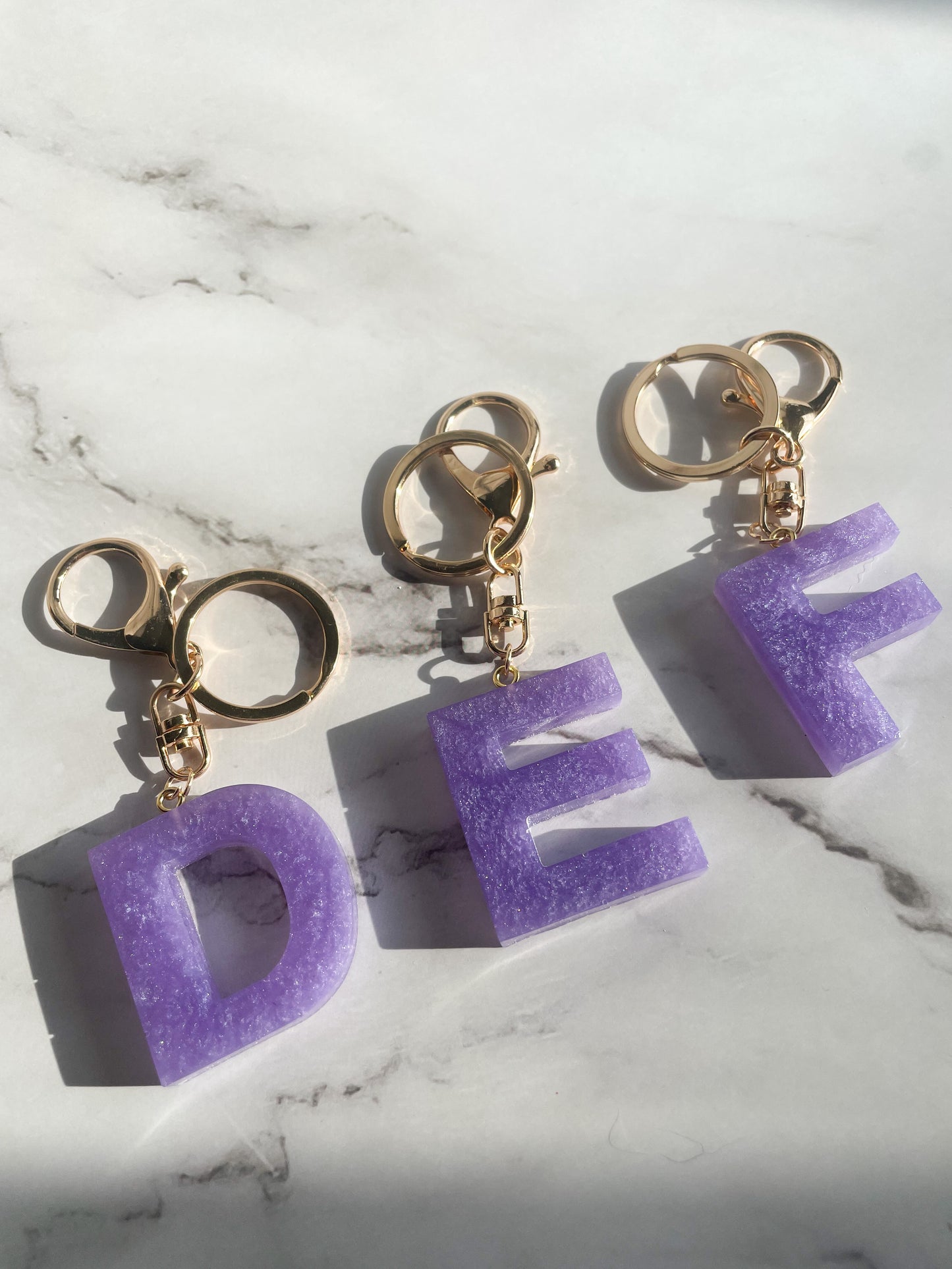 Purple initial w/gold lobster clip keychain