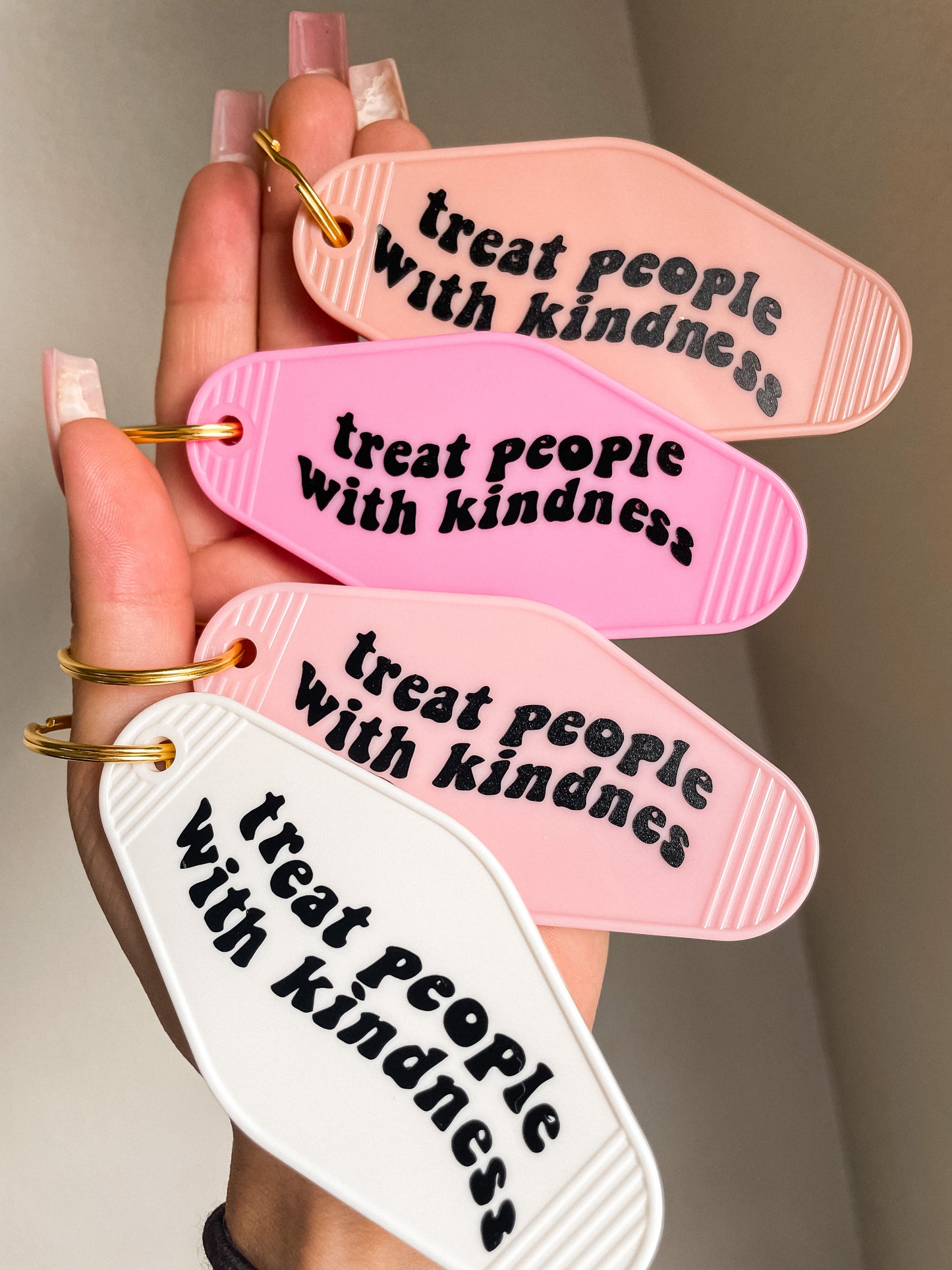 Treat people with kindness motel Keychain