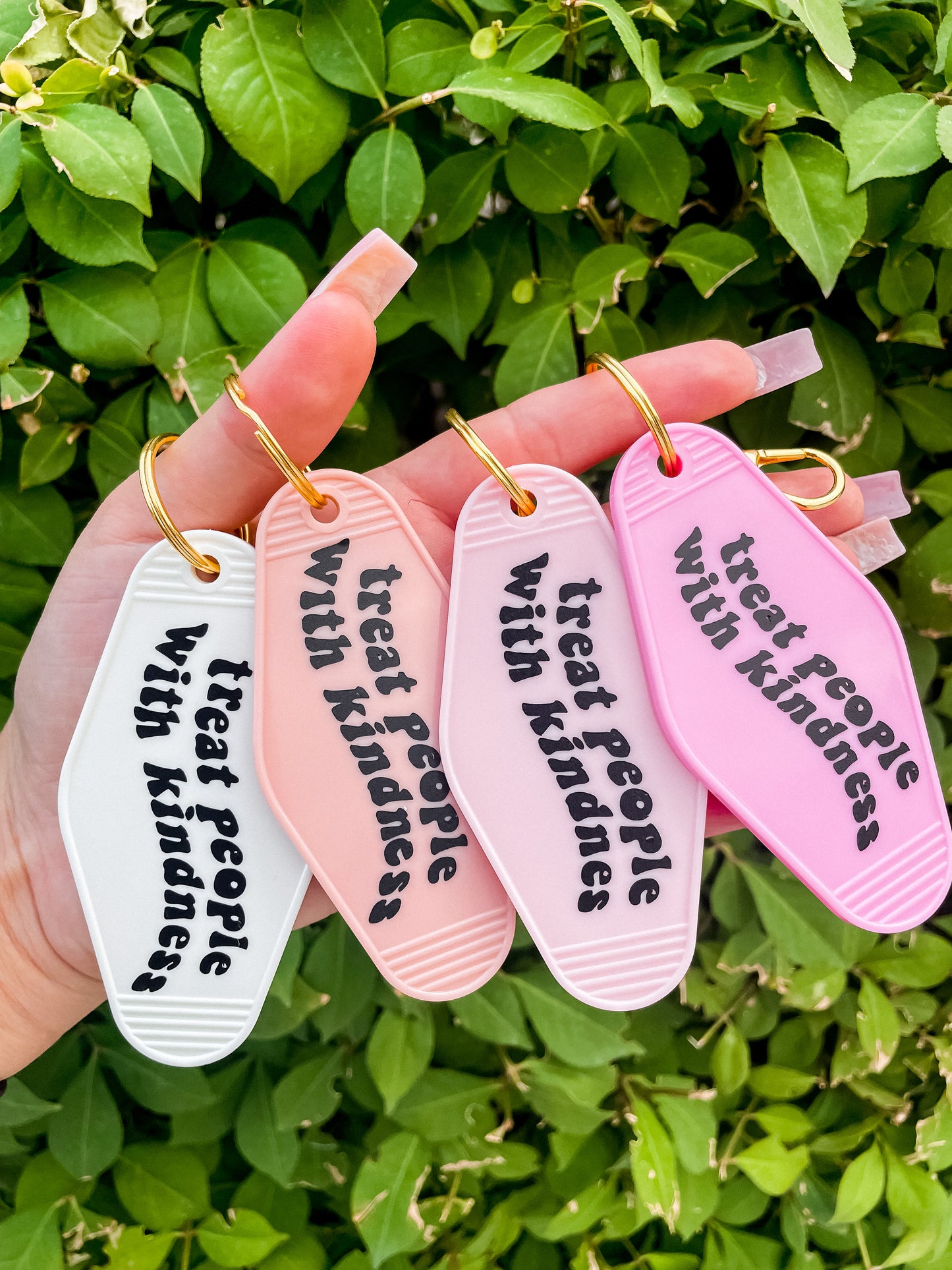 Treat people with kindness motel Keychain