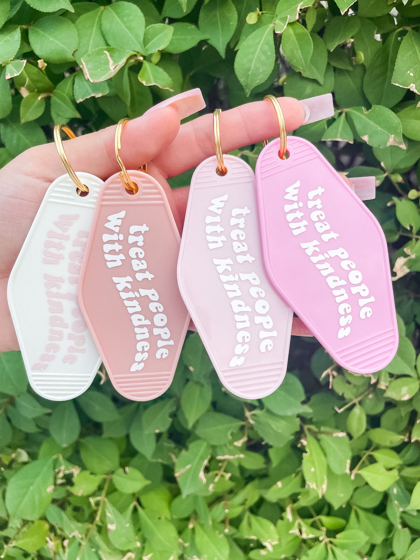 Treat people with kindness motel Keychain