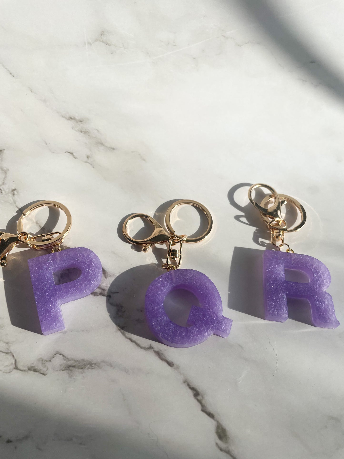 Purple initial w/gold lobster clip keychain