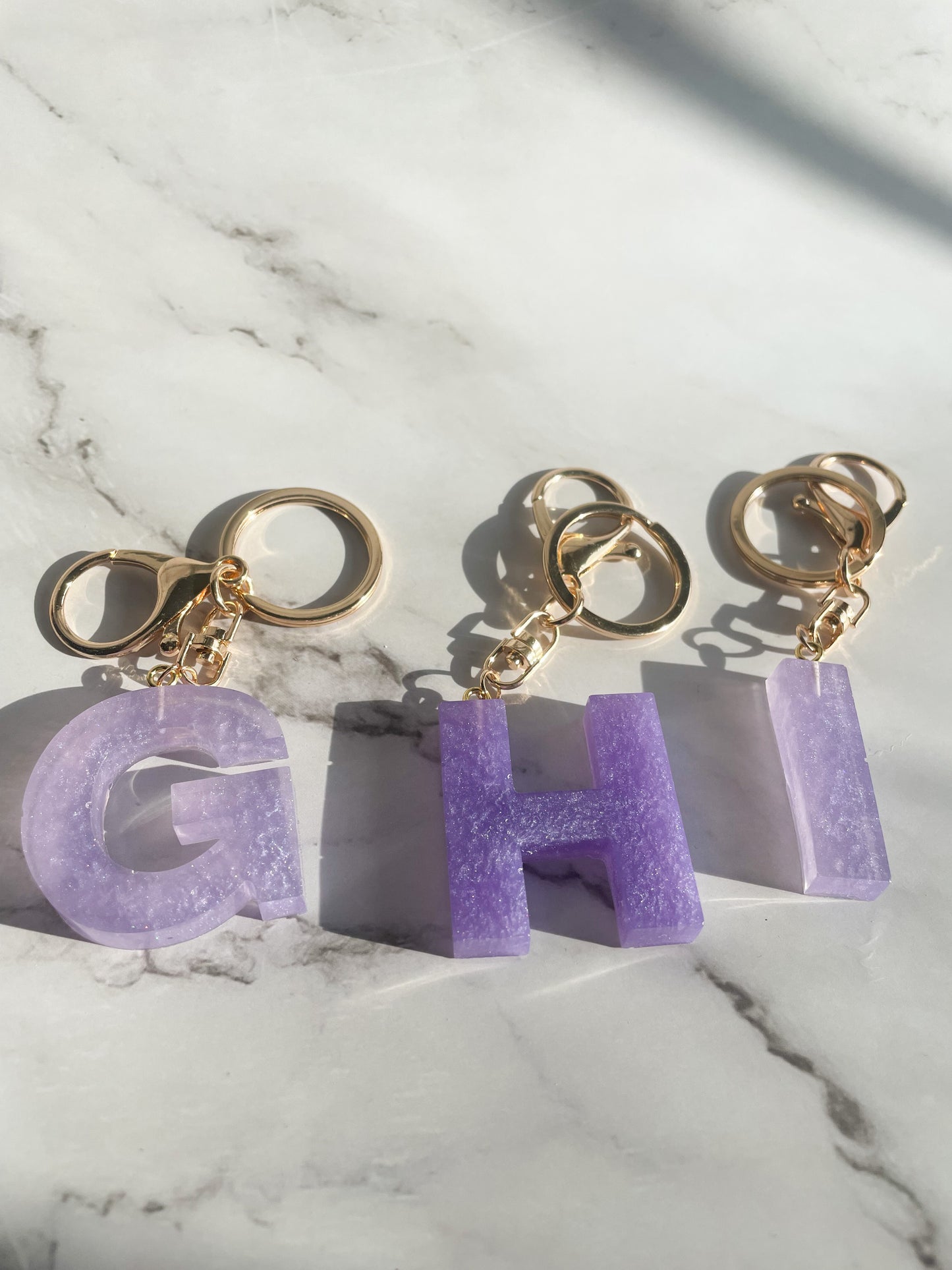 Purple initial w/gold lobster clip keychain