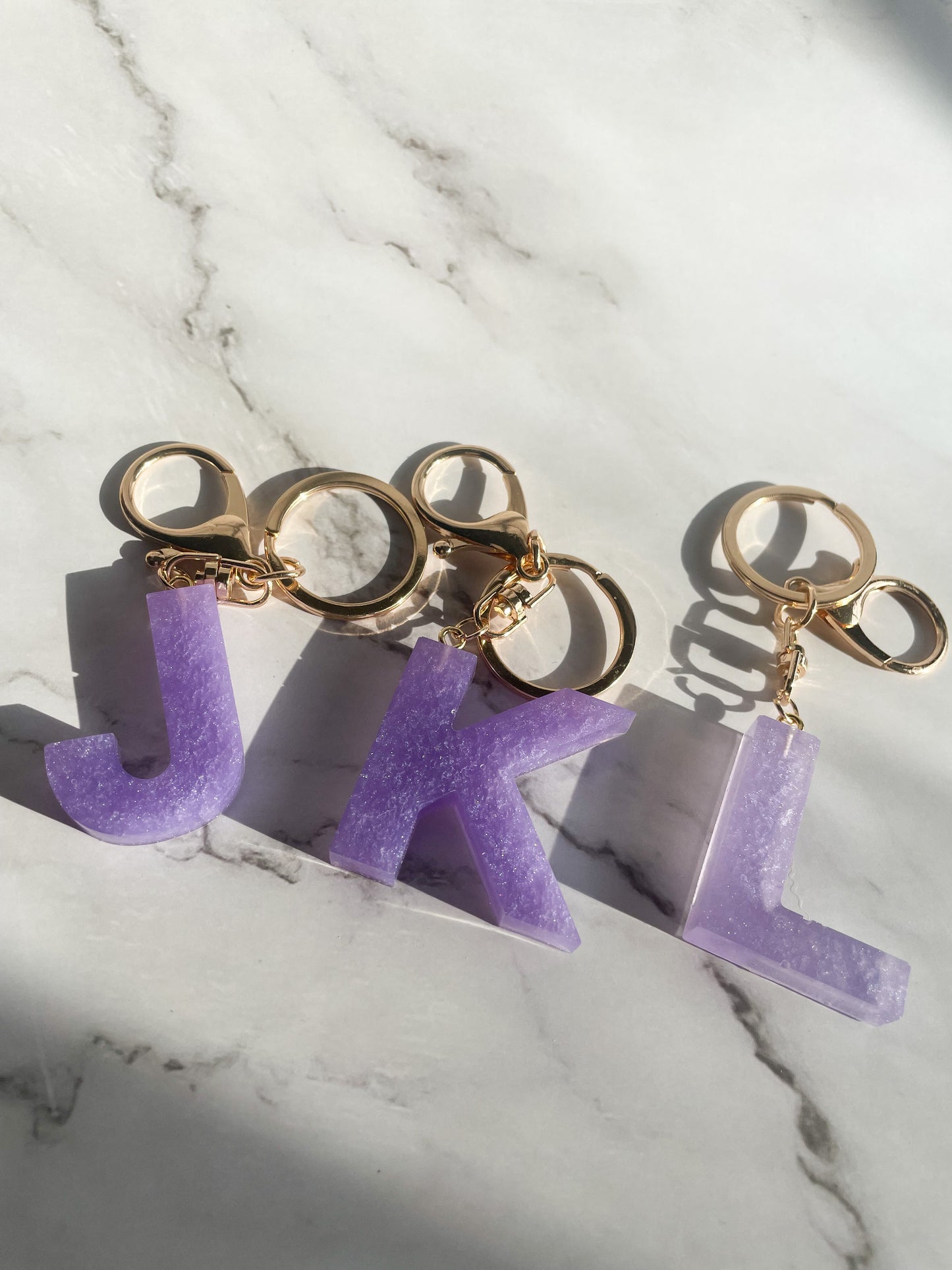 Purple initial w/gold lobster clip keychain