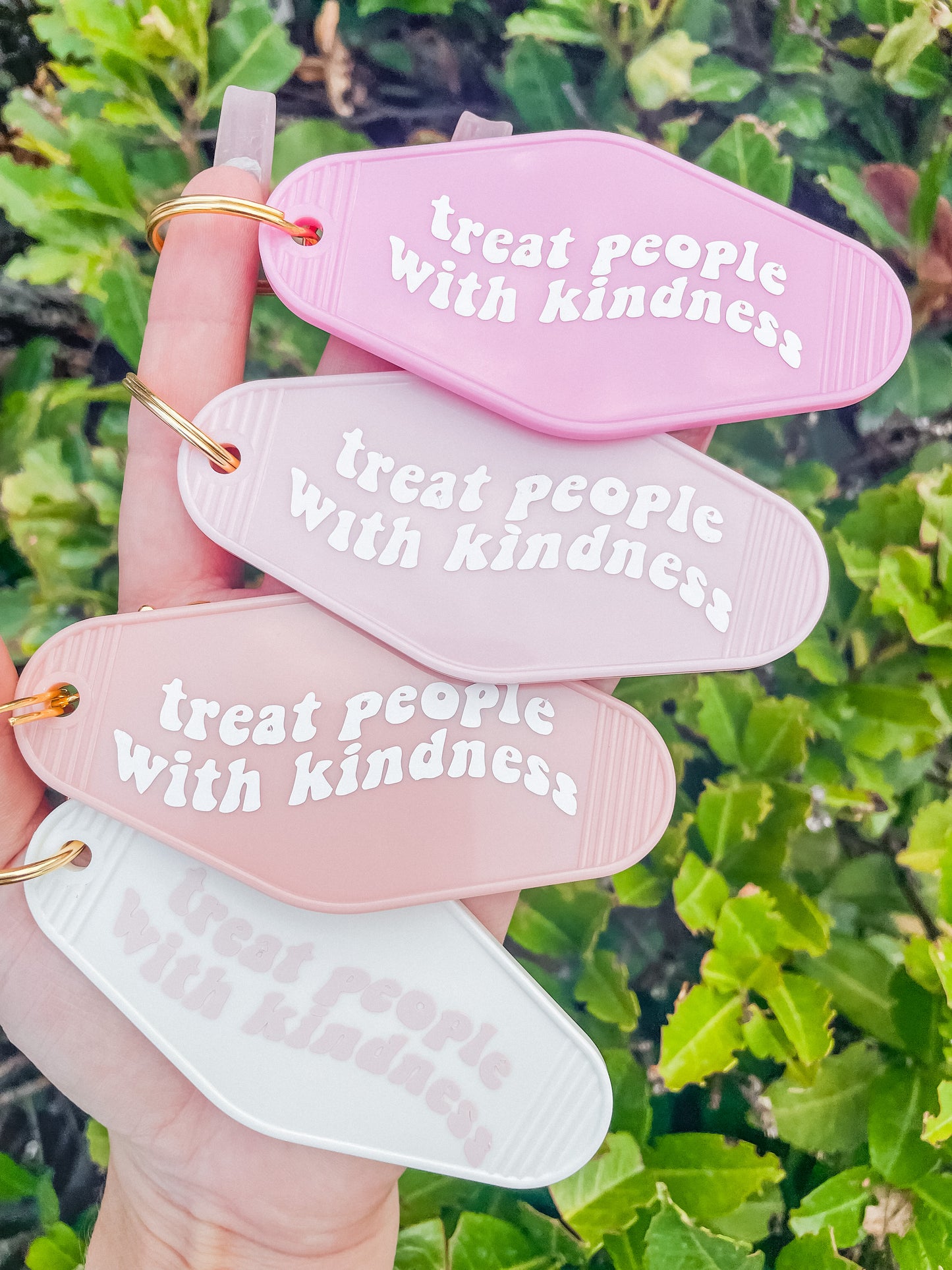 Treat people with kindness motel Keychain